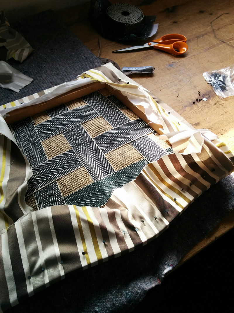 Top layer of fabric on and rough tacked.