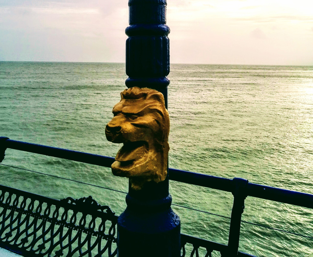 gold lion head on Eastbourne pier
