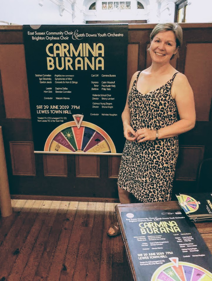 Robin with the poster she designed for Carmina Burana