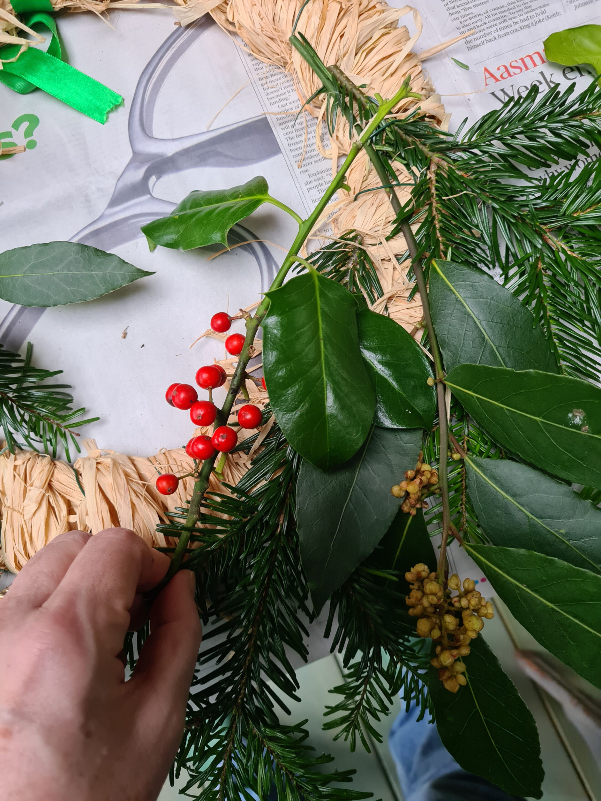 assenbling a christmas wreath